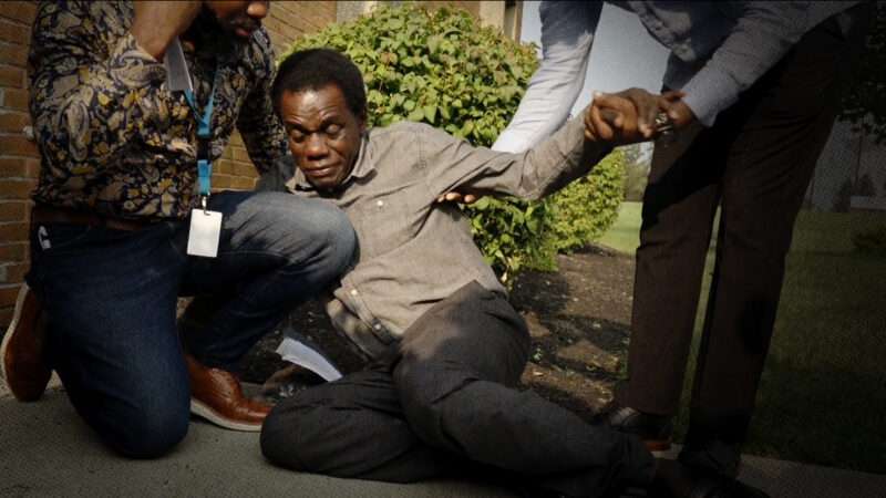 A Haitian national collapses after being fitted with an ankle monitor | Freedomnews.TV/@ScooterCasterNY/X