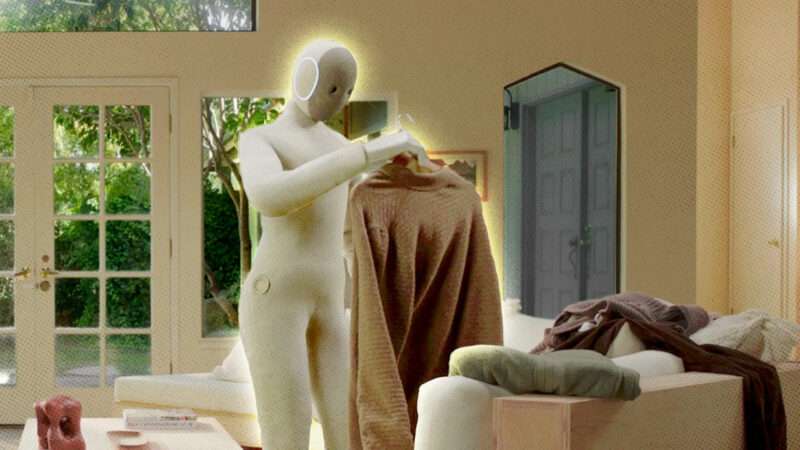 A photo of a humanoid robot handling clothes in a living room | X1