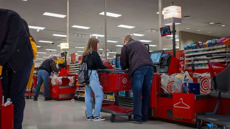 Shoppers use a self checkout at Target. | ColleenMichaels/Dreamstime