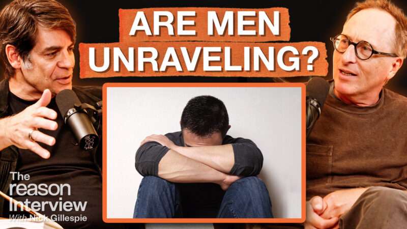 Nick Gillespie appears on the left. Jon Ronson appears on the right. In the center square, an image of a seated man with his head down, hiding his face in his arms appears. Bold text across the top of the screen reads "ARE MEN UNRAVELING?" | Illustration: Fatima Ruiz