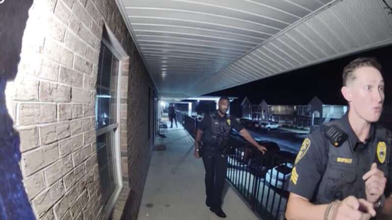 A Greenville, North Carolina, police officer speaks to an apartment resident, as seen on her Ring video doorbell. | WITN