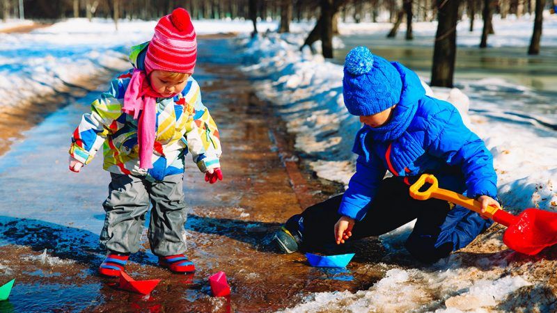 children playing outside in snow