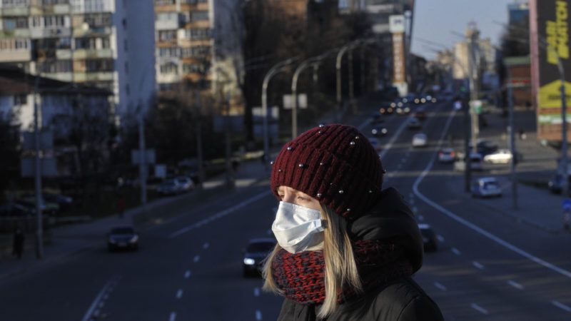 masked-pedestrian-3-24-20-Newscom | Sergei Chuzavkov/Sopa Images/Newscom