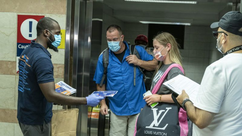 "Members of the Test & Trace Corps meet people arriving by Amtrak from Miami at Penn Station in New York on August 6, 2020." | Lev Radin/Sipa USA/Newscom