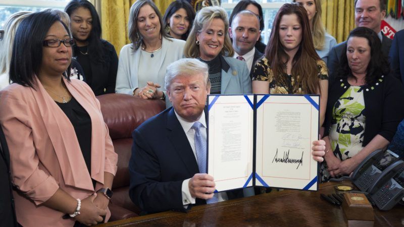 Trump signing FOSTA into law on April 11, 2018 | Chris Kleponis/SIPA/Newscom