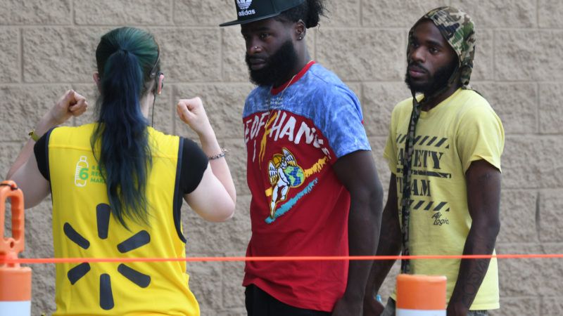 Racine Wisconsin Walmart greeter tells customers about mask policy | Mark Hertzberg/ZUMA Press/Newscom