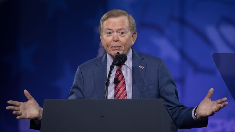 Lou Dobbs speaks behind a podium | Jeff Malet Photography/Newscom