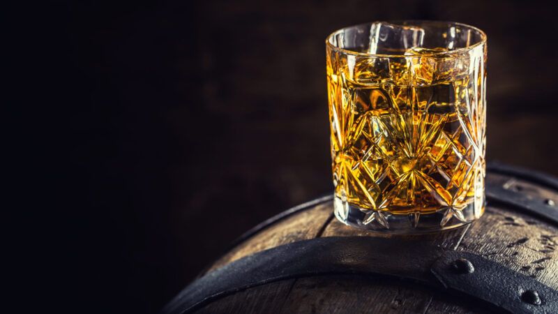 dreamstime_xl_95758435 | Photo <a href="https://www.dreamstime.com/stock-photo-whiskey-drink-glass-whiskey-old-wooden-barrel-image95758435">95758435</a> © <a href="https://www.dreamstime.com/marianvejcik_info" itemprop="author">Marian Vejcik</a> - <a href="https://www.dreamstime.com/">Dreamstime.com</a>