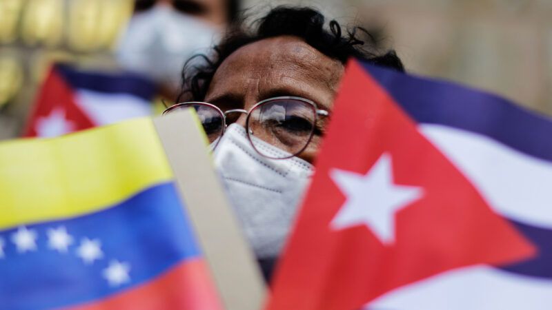 Members of the Portuguese Communist Party Youth carry flags and