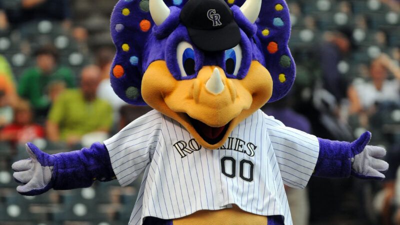 Colorado Rockies mascot, Dinger, tackled by fan during baseball