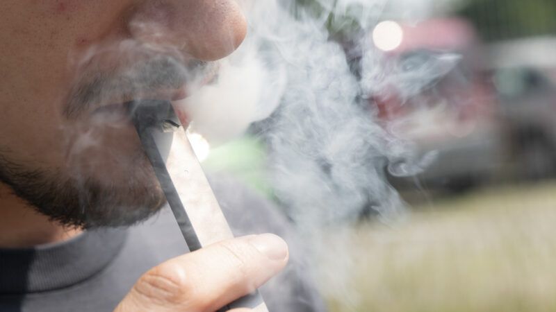 man vaping outdoors closeup | Mundl Richard/Zuma Press/Newscom