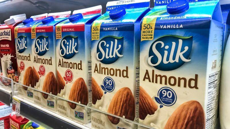 Cartons of almond milk at a grocery store