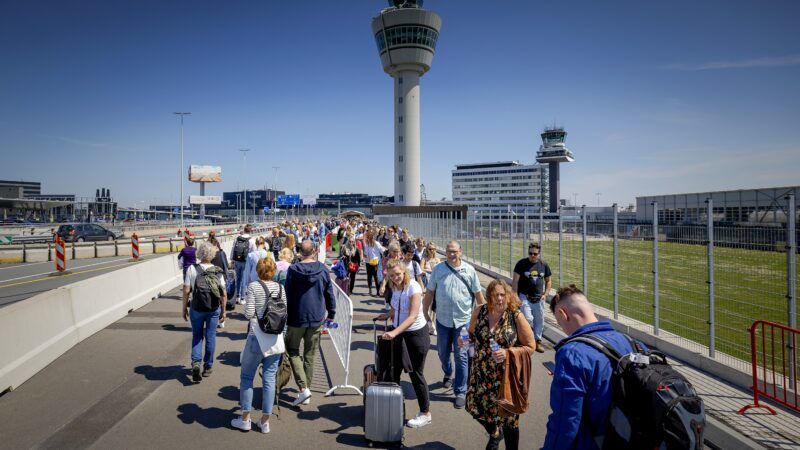 Travelers at the airport | Robin van Lonkhuijsen/ANP/Newscom