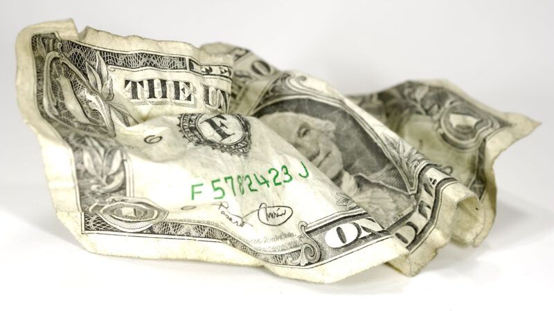 US dollar bill crumpled up