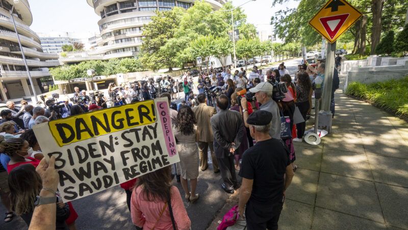 Protestors outside the Saudi embassy in the United States carrying a sign saying "Danger! Biden, stay away from Saudi regime" | Ken Cedeno/UPI  