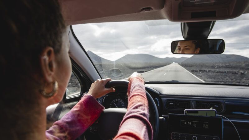 woman driving out of state | Michela Ravasio/Westend61 GmbH/Newscom