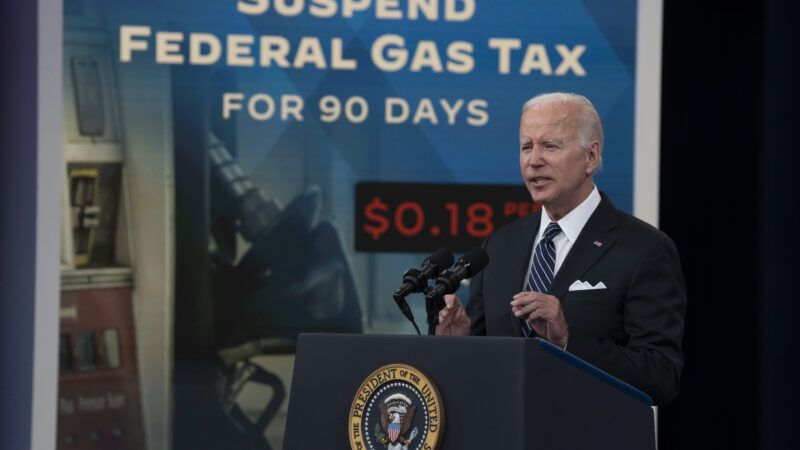 Biden is standing at a podium talking about lowering the gas prices.