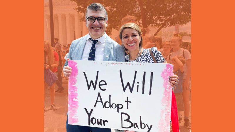 A Mom and Dad are holding a poster that says "we will adopt your baby"