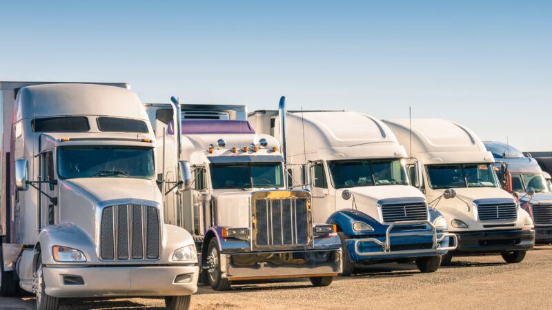 Long-haul trucks idling at a truck stop