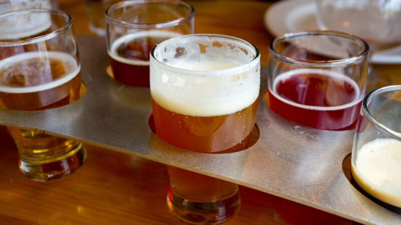 Multiple beers in a flight on a table