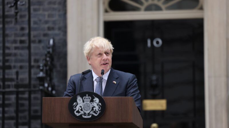 Boris Johnson stands at a podium giving a speech on Downing Street