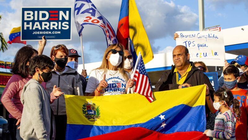 Venezuelans celebrating with flags and signs from the Biden/Harris Presidential campaign