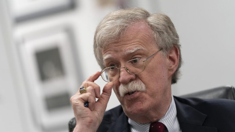 John Bolton adjusting his glasses. | Chris Kleponis/Polaris/Newscom