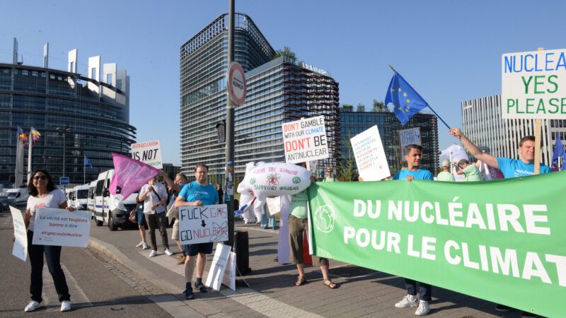 European climate protesters holding banners