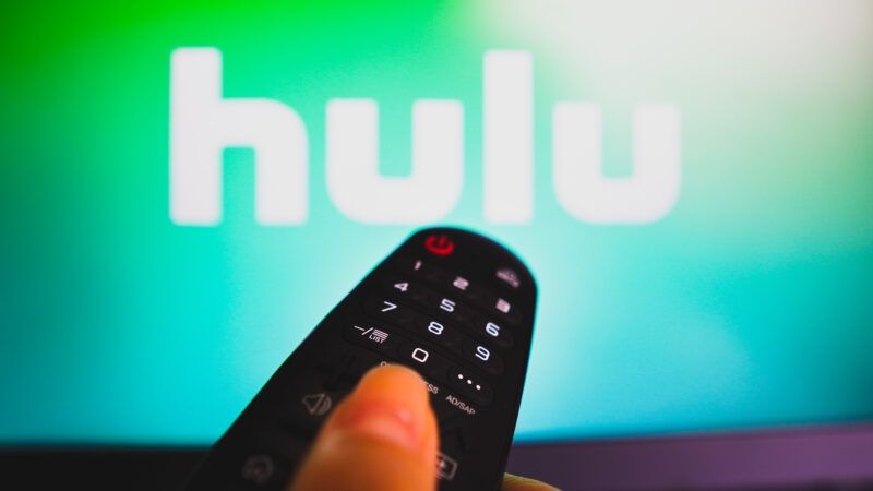 remote control pointed at screen with Hulu logo on it