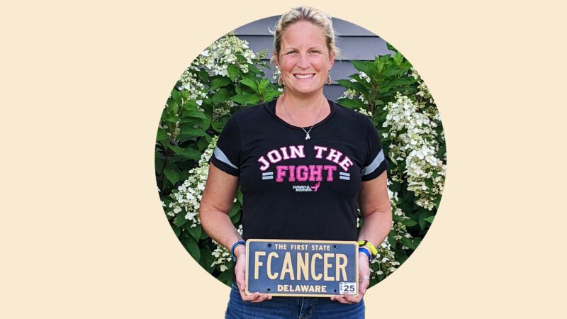 Kari Lynn Overington holds her FCANCER vanity plate