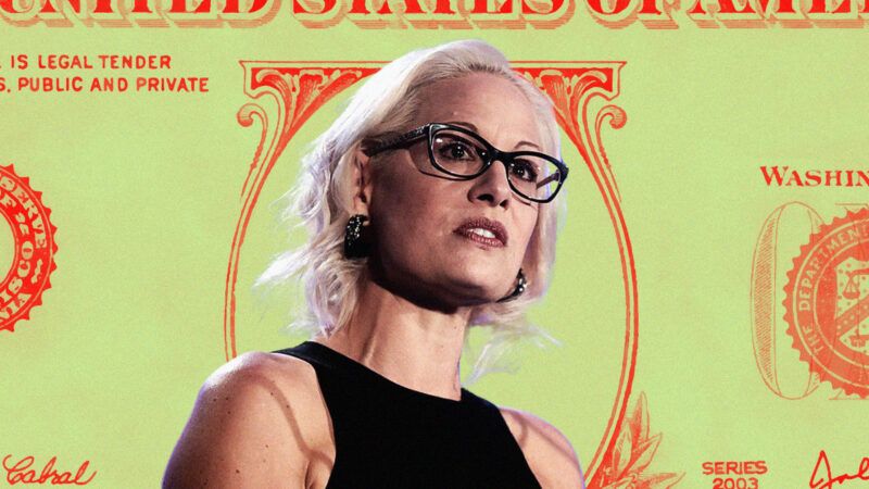 Senator Sinema stands in front of US dollars