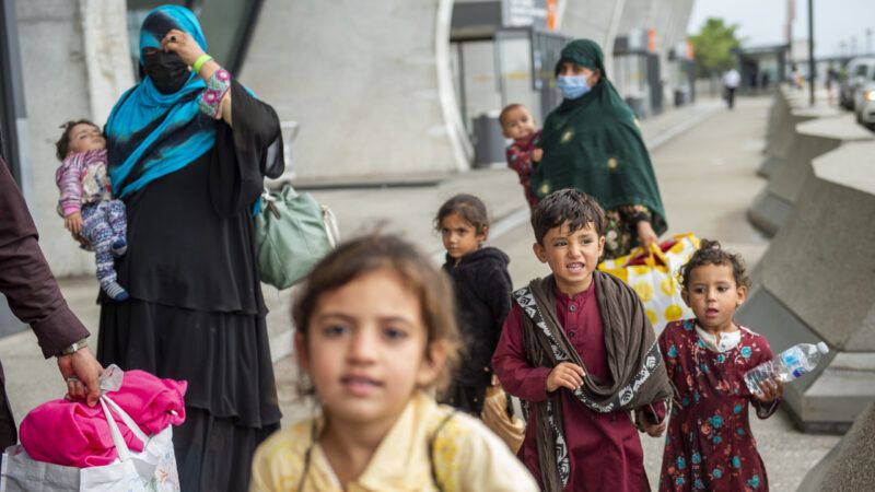 Afghan evacuees arrive at Dulles International Airport in Virginia