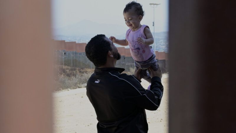 Migrants border wall San Diego