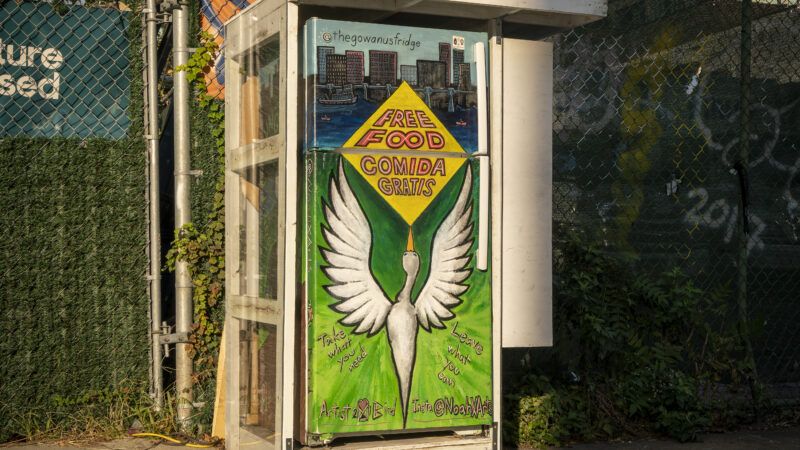 fridge with a bird painted on it