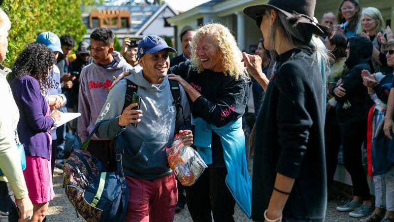 Volunteer greets migrant on Martha's Vineyard