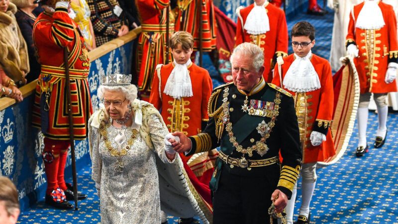 Queen Elizabeth II and then-prince of Wales Charles walking together at a royal ceremony.