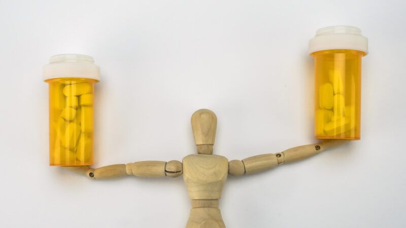 dummy holding prescription pill bottles | DIGICOMPHOTO/SCIENCE PHOTO LIBRARY/Newscom