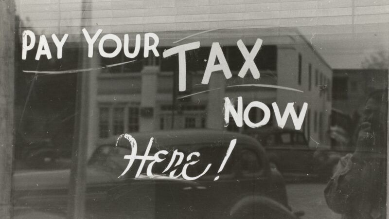 "pay your tax now here" sign