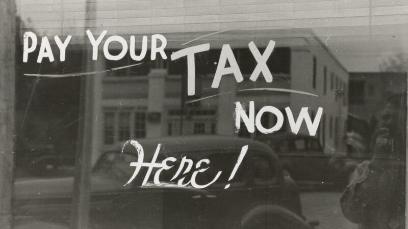 "pay your tax now here" sign | Photo by <a href="https://unsplash.com/@nypl?utm_source=unsplash&utm_medium=referral&utm_content=creditCopyText">The New York Public Library</a> on <a href="https://unsplash.com/?utm_source=unsplash&utm_medium=referral&utm_content=creditCopyText">Unsplash</a>   