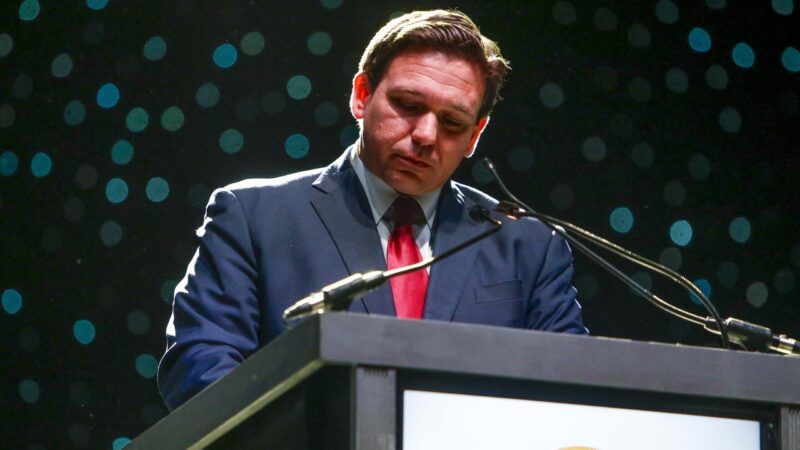 Florida Gov. Ron DeSantis looks down during a speech