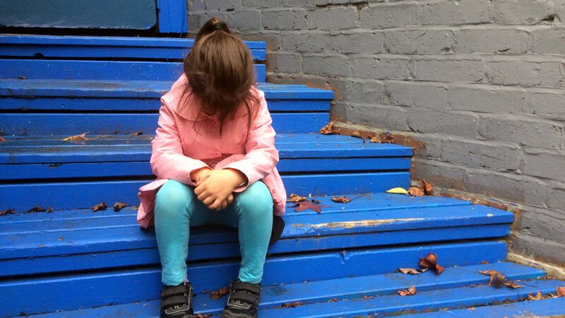 Kid on steps looking dejected | Rafael Ben-Ari/Chameleons Eye/Newscom