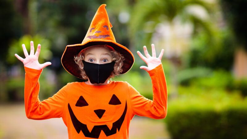 Kid in Halloween costume and mask