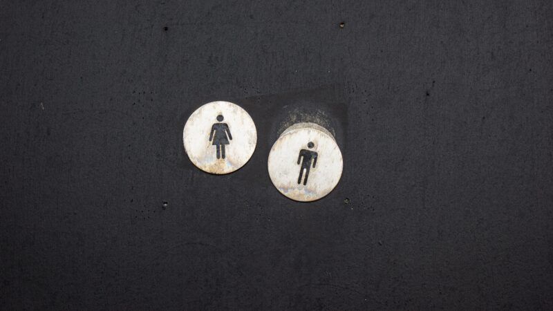 man and women signs in black and white