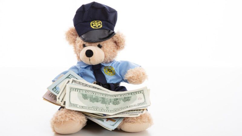 Police teddy bear with cash