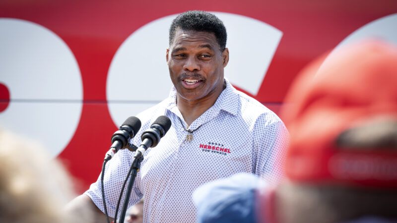Football star and Senate candidate Herschel Walker addresses a crowd of supporters.