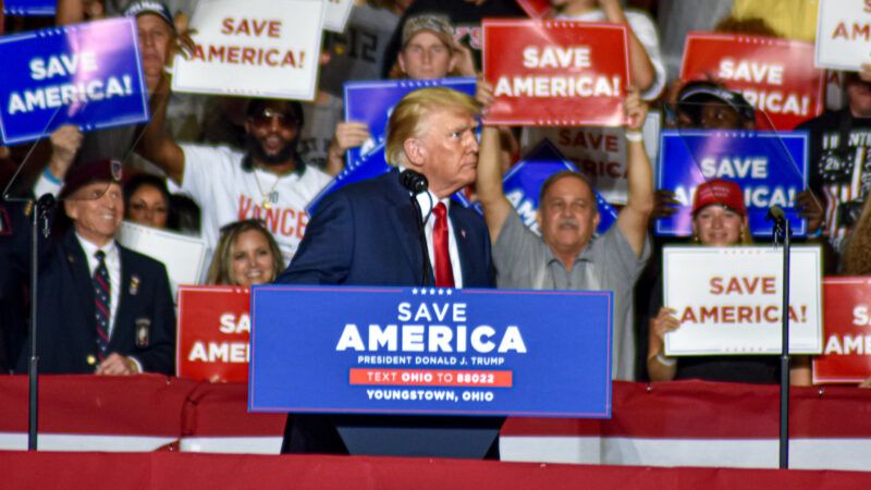 Donald Trump at a podium for a rally