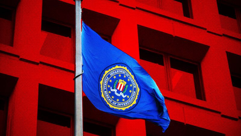 The FBI flag against a red backdrop of the J. Edgar Hoover building.
