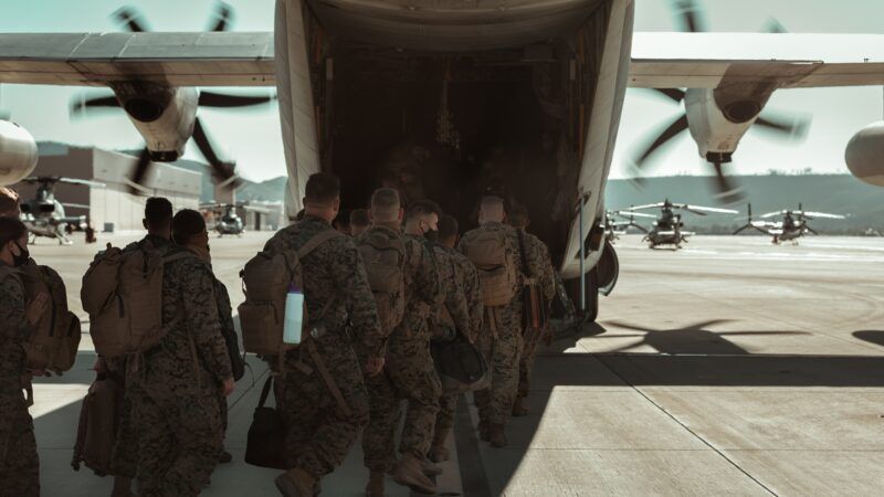 troops boarding plane | Photo by <a href="https://unsplash.com/@actuallyjoel?utm_source=unsplash&utm_medium=referral&utm_content=creditCopyText">Joel Rivera-Camacho</a> on <a href="https://unsplash.com/?utm_source=unsplash&utm_medium=referral&utm_content=creditCopyText">Unsplash</a>   