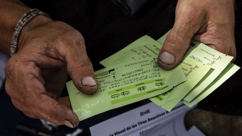 man holding fentanyl test strips | Albuquerque Journal/ZUMAPRESS/Newscom