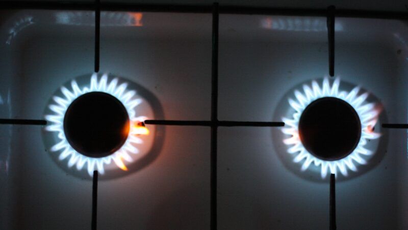 burners lit on gas stove from above
